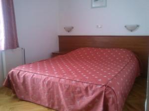 Un pat sau paturi într-o cameră la Hotel Zuco