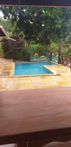 a small swimming pool in a yard with at Casa da Socorro - Serra de Guaramiranga in Pacoti