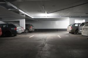 a parking garage with cars parked in it at Apartmán u sjezdovky Javor in Pec pod Sněžkou