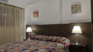 Säng eller sängar i ett rum på Apartamento Edificio Crucero
