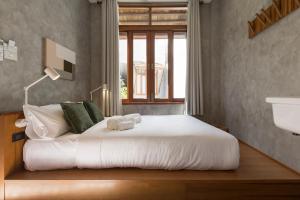 Ein Bett oder Betten in einem Zimmer der Unterkunft Hidden Garden Hostel