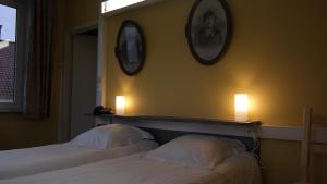En eller flere senge i et værelse på De Bonte Os Hotel & Tower
