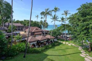 an aerial view of a resort with palm trees at Impiana Beach Front Resort Chaweng Noi, Koh Samui in Chaweng Noi Beach
