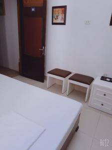 Voodi või voodid majutusasutuse Hanoi Carina Hotel toas