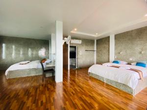 Cama o camas de una habitación en Phumektawan ภูเมฆตะวัน Hotel&Restaurant