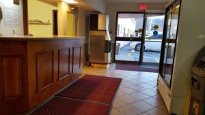 a kitchen with a counter and a view of a car at Budget inn 2000 in Hamilton