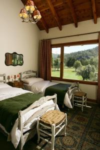 Кровать или кровати в номере Alhue - Casa en el Golf