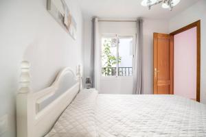 Ein Bett oder Betten in einem Zimmer der Unterkunft Apartamento Conil Centro