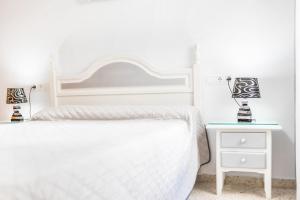 Ein Bett oder Betten in einem Zimmer der Unterkunft Apartamento Conil Centro