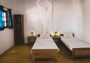 Voodi või voodid majutusasutuse Surfpoint Sri Lanka Kite Village toas