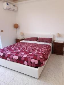 Ένα ή περισσότερα κρεβάτια σε δωμάτιο στο La casa tra gli ulivi di Fonte Nuova 2