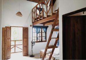 Postel nebo postele na pokoji v ubytování Surfpoint Sri Lanka Kite Village