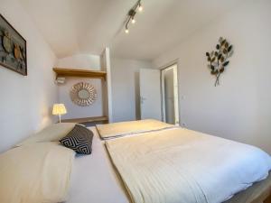 a bedroom with a large bed in a room at Eco Sunshine Apartments Lumbarda in Lumbarda