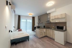 Fibula Residence Hotel & Wellness - Adults Only tesisinde mutfak veya mini mutfak