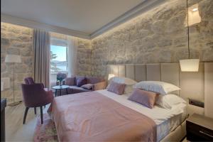 Postel nebo postele na pokoji v ubytování Heritage Hotel Leon Coronato