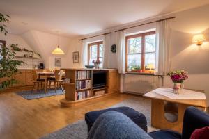 a living room with a couch and a table at Apfelblüte in Lindau