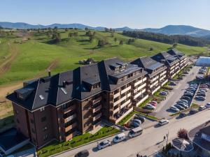 an aerial view of a building with a parking lot at Kalman SPA&GYM in Zlatibor