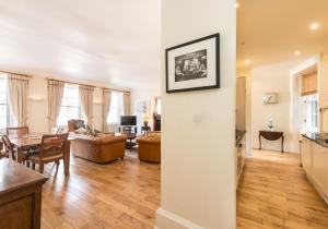 a living room with a table and a dining room at Parliament Sq (apt 10 ) Royal Mile in Edinburgh