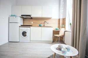 Kuchyňa alebo kuchynka v ubytovaní Apartamenty Centrum