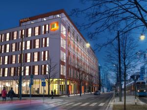 a building with a sign on the side of a street at Motel L Hammarby Sjöstad in Stockholm