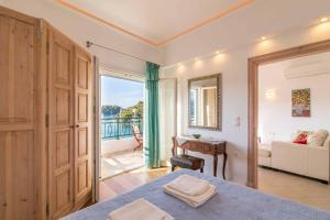 A bed or beds in a room at Lakka Seaview Apartments by Konnect