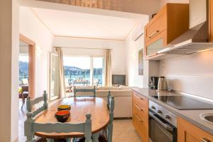 A kitchen or kitchenette at Lakka Seaview Apartments by Konnect