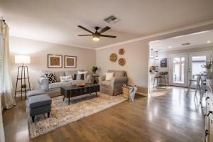 a living room with a couch and a ceiling fan at Phoenix Arcadia Turney home in Phoenix