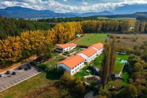 an aerial view of a building with orange roofs at Wolkendorf Bio Hotel & Spa in Vulcan