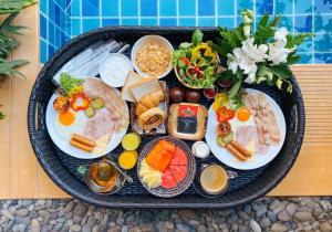 a tray of food with different types of food at Aurico Kata Resort & Spa - SHA Extra Plus in Kata Beach