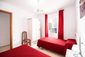 Ein Bett oder Betten in einem Zimmer der Unterkunft Apartamento Conil Centro