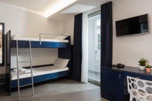 Postel nebo postele na pokoji v ubytování Cavour 19 - Dependance