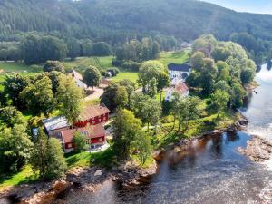 an aerial view of a house next to a river at Boen Gård in Kristiansand