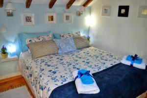 En eller flere senge i et værelse på Casinha de Belém