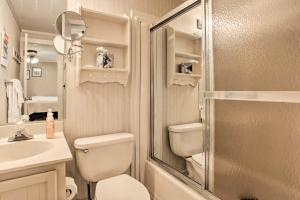 a bathroom with a shower and a toilet and a sink at Slopeside Snowshoe Condo - Walk to Ski Lifts! in Dunmore +20 photos