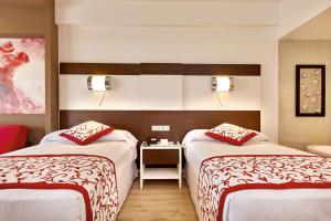 Postel nebo postele na pokoji v ubytování Riu Palace Costa Mujeres - All Inclusive