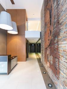 a brick wall in the hallway of a building at AT Suites in Córdoba