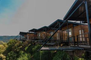 a building on the side of a hill with stairs at Hotel Resort Del Cafe in Manizales