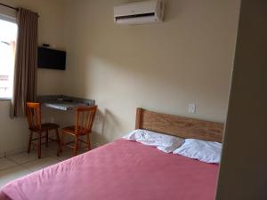 Cama o camas de una habitación en Pousada Porto dos Mares