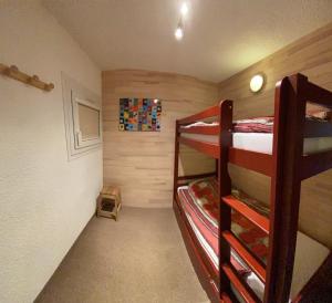 a bunk bed room with two bunk beds in it at Boost Your Immo Le Césier Risoul 479 in Risoul