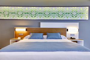 Postel nebo postele na pokoji v ubytování Riu Palace Costa Mujeres - All Inclusive