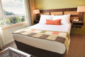 Postel nebo postele na pokoji v ubytování Solace Hotel Puerto Varas