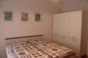 Postel nebo postele na pokoji v ubytování Apartman 825