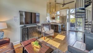 a living room with a flat screen tv and a couch at The Addition Smart Home with direct IN Dunes National Park Beach access in Gary