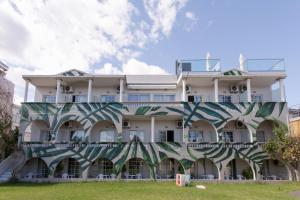 a building with a mural on the side of it at Georgioupolis Beach Hotel in Georgioupolis