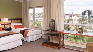 Postel nebo postele na pokoji v ubytování Solace Hotel Puerto Varas