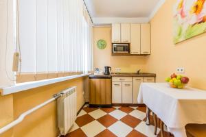 a small kitchen with a table and a counter at 2к квартира біля Олімпійського, Центр in Kyiv