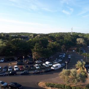 an aerial view of a parking lot with cars at Studette accès plage in Saint-Jean-de-Monts