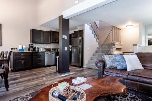 a living room with a couch and a kitchen at Chamonix # 88 in Mammoth Lakes