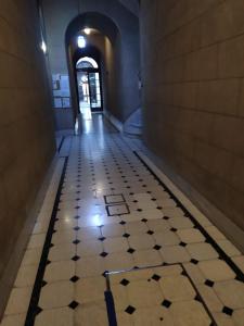 a hallway with a tiled floor in a building at Calido alojamiento en San Telmo EH in Buenos Aires