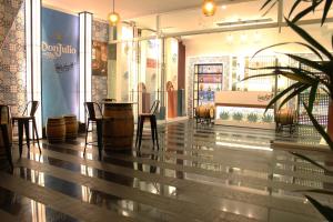 a restaurant with chairs and a table in a store at Barceló Mexico Reforma in Mexico City
